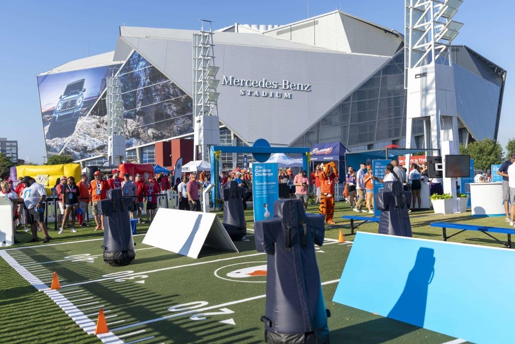 Fans at the Aflac Fan Experience and Tailgate Town outside Mercedes-Benz Stadium ahead of the Aflac Kickoff Game