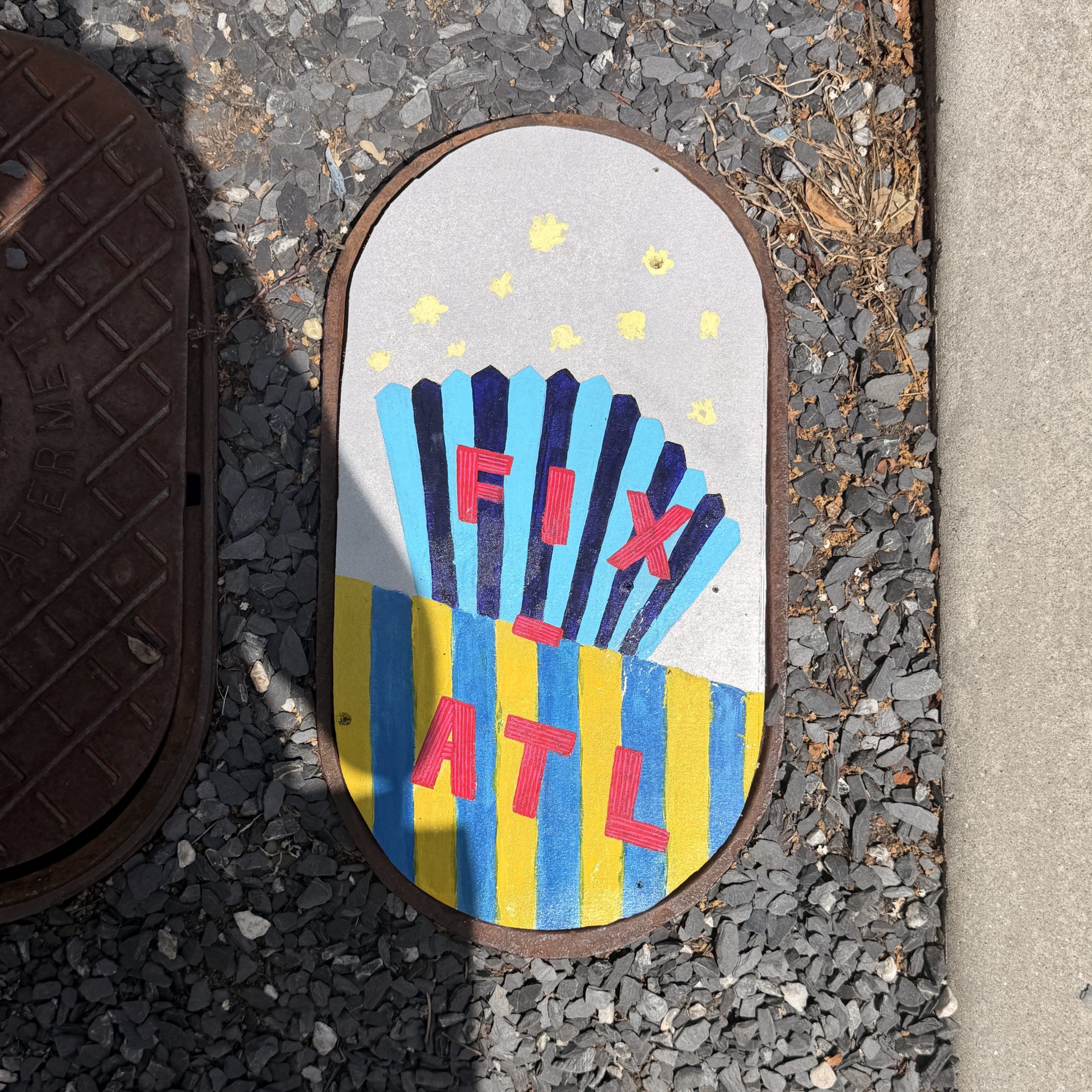 An anonymous Atlantan is covering the city's open sidewalk holes with painted plywood patches