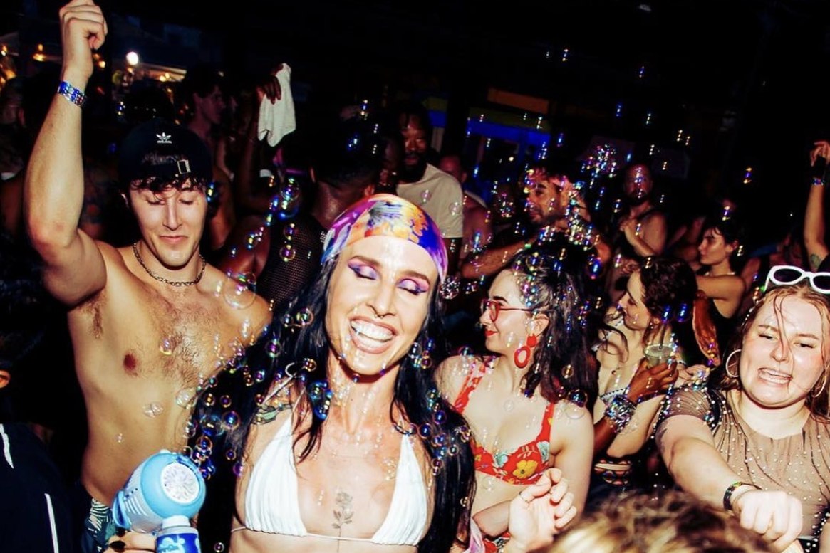 Dancers and bubbles at a crowded Chaka Khan Hacienda day party