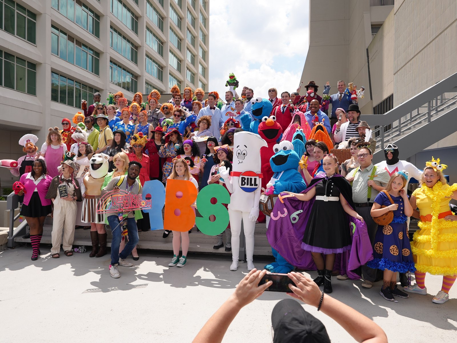 Dragon Con attendees dressed as PBS characters pose for a group photo at the convention's 40th anniversary in downtown Atlanta