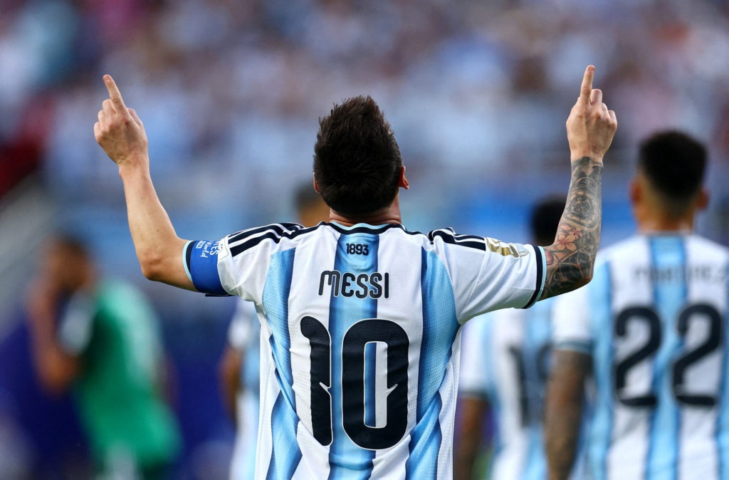 Lionel Messi raises both arms celebrating a goal for Argentina at the 2026 World Cup