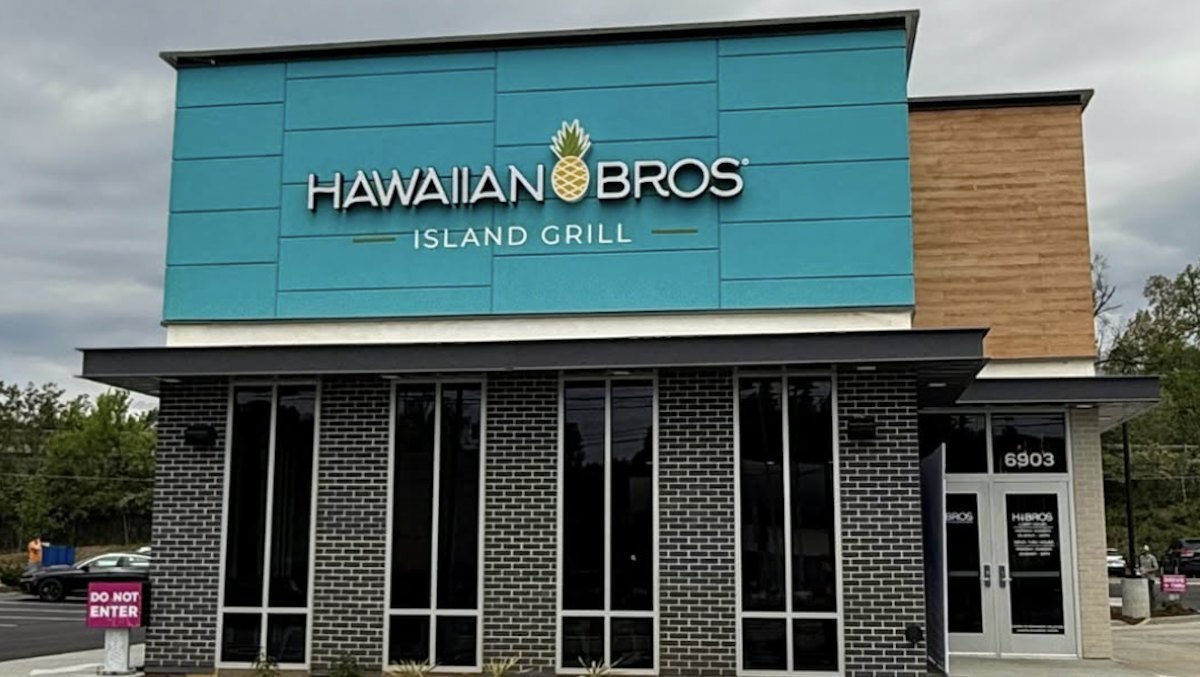 Teal Hawaiian Bros Island Grill sign with pineapple logo above the glass storefront of an existing location