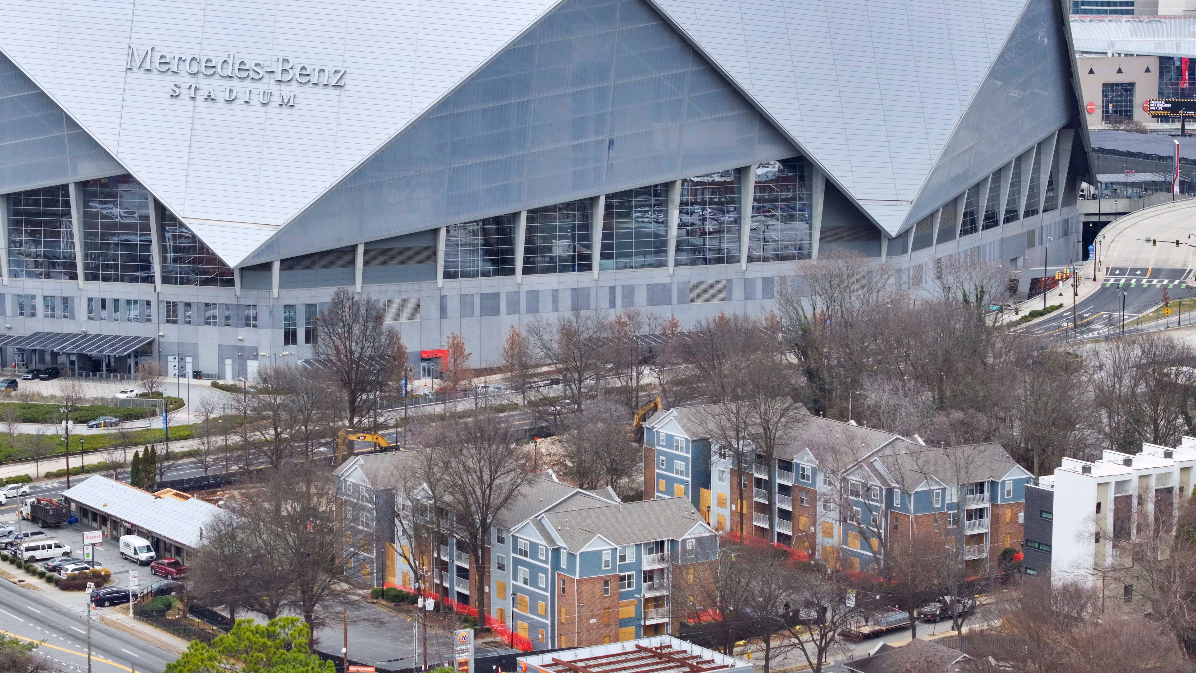 The Northside Plaza apartments in the foreground, south of Mercedes-Benz Stadium, being studied for a mixed-use residential and retail development by Carter.