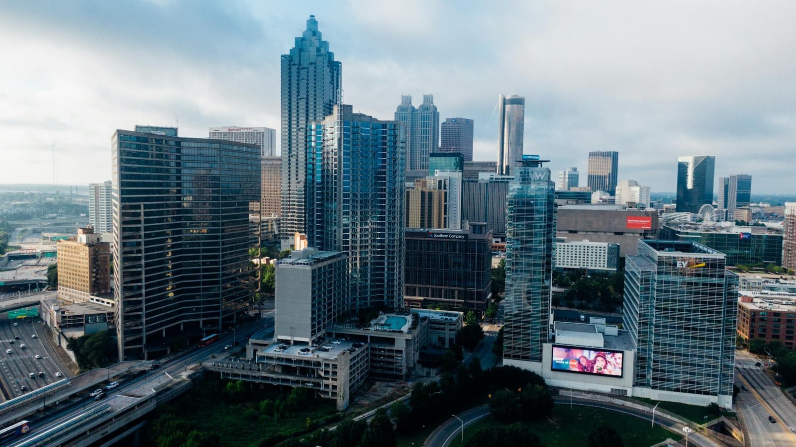 Aerial view of the downtown Atlanta skyline with high-rise towers above the Downtown Connector