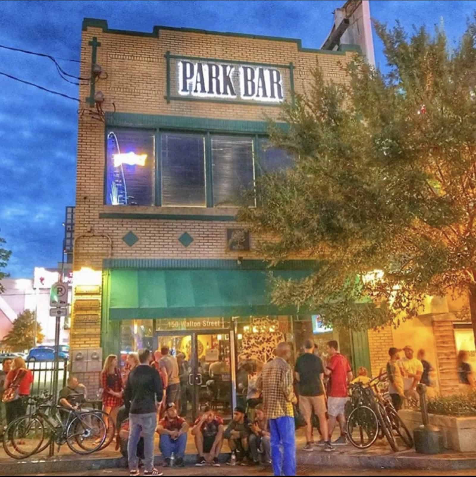 Park Bar at 150 Walton Street NW in downtown Atlanta at dusk, with a crowd outside the entrance