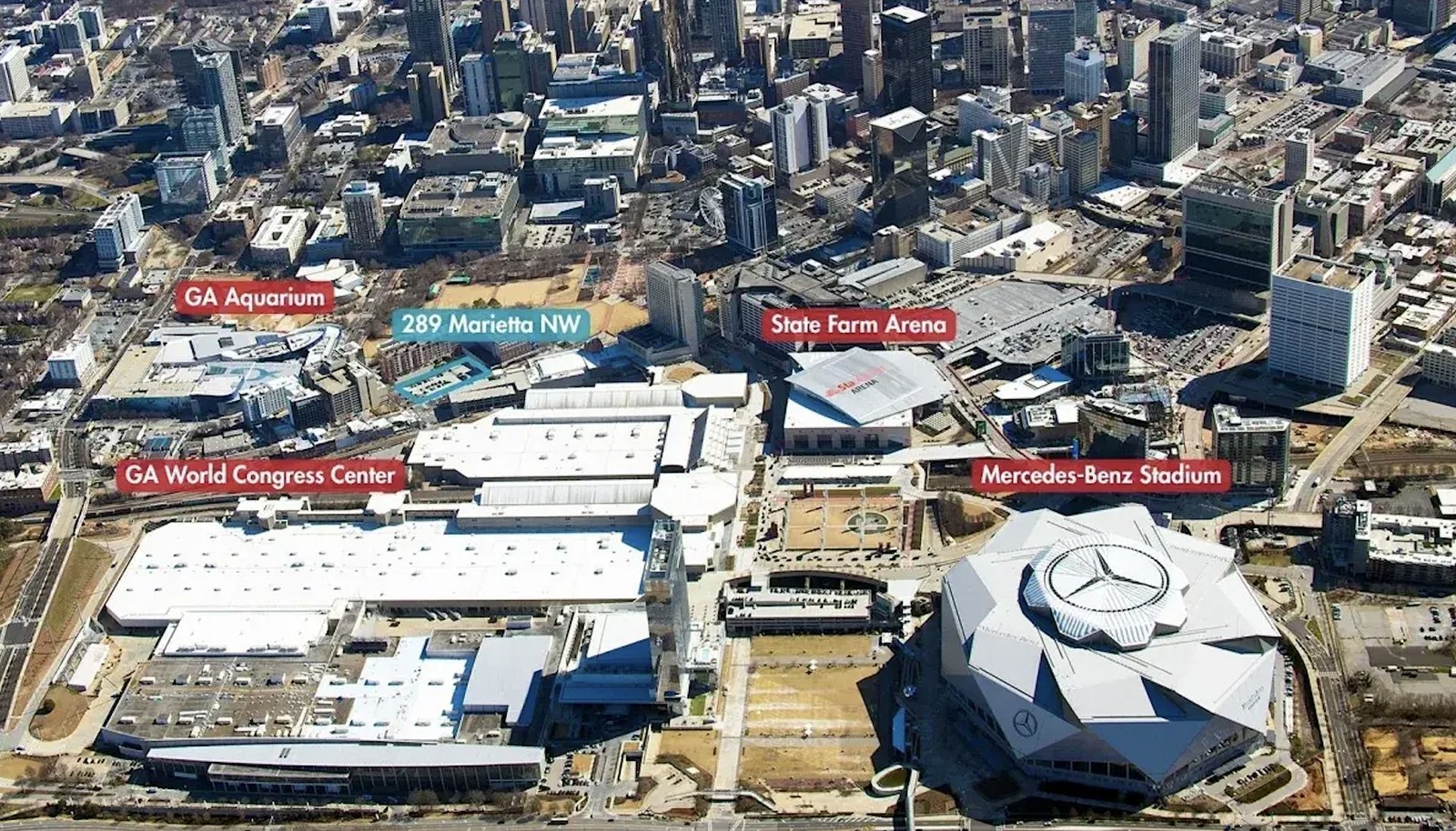 Aerial view of downtown Atlanta marking 289 Marietta Street NW near the Georgia Aquarium and State Farm Arena