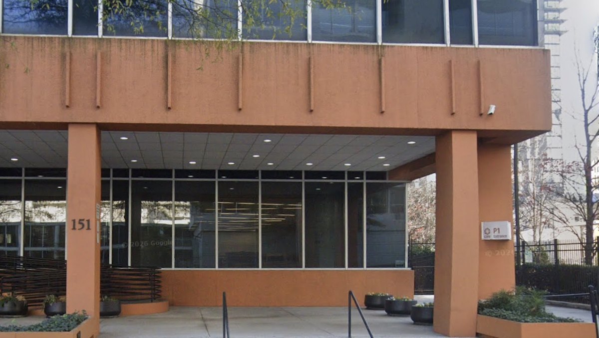 Covered entrance of the terracotta-colored office building at 151 Ellis St. NE in downtown Atlanta