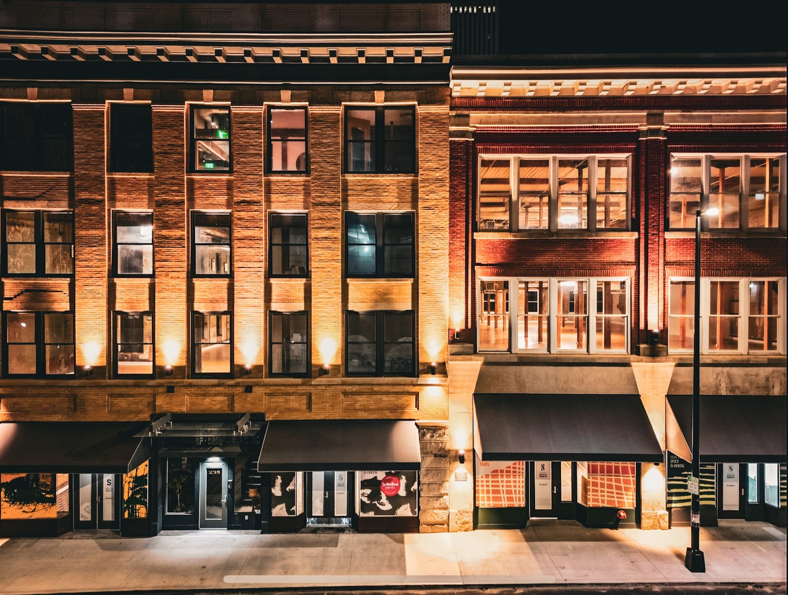 Hotel Row along Mitchell Street in South Downtown Atlanta at night, with the historic Sylvan Hotel on the left