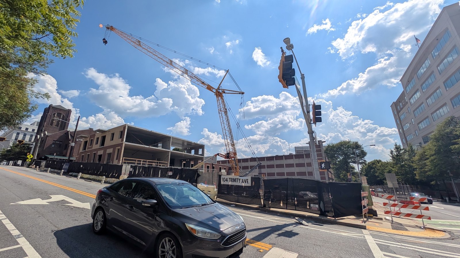 Tower crane over the Trinity Central Flats construction site at 104 Trinity Ave. and Shirley C. Franklin Boulevard in downtown Atlanta, September 2026