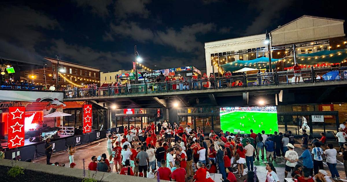 Crowds gathered under string lights at Underground Atlanta during 2026 FIFA World Cup festivities on Upper Alabama Street in downtown Atlanta.