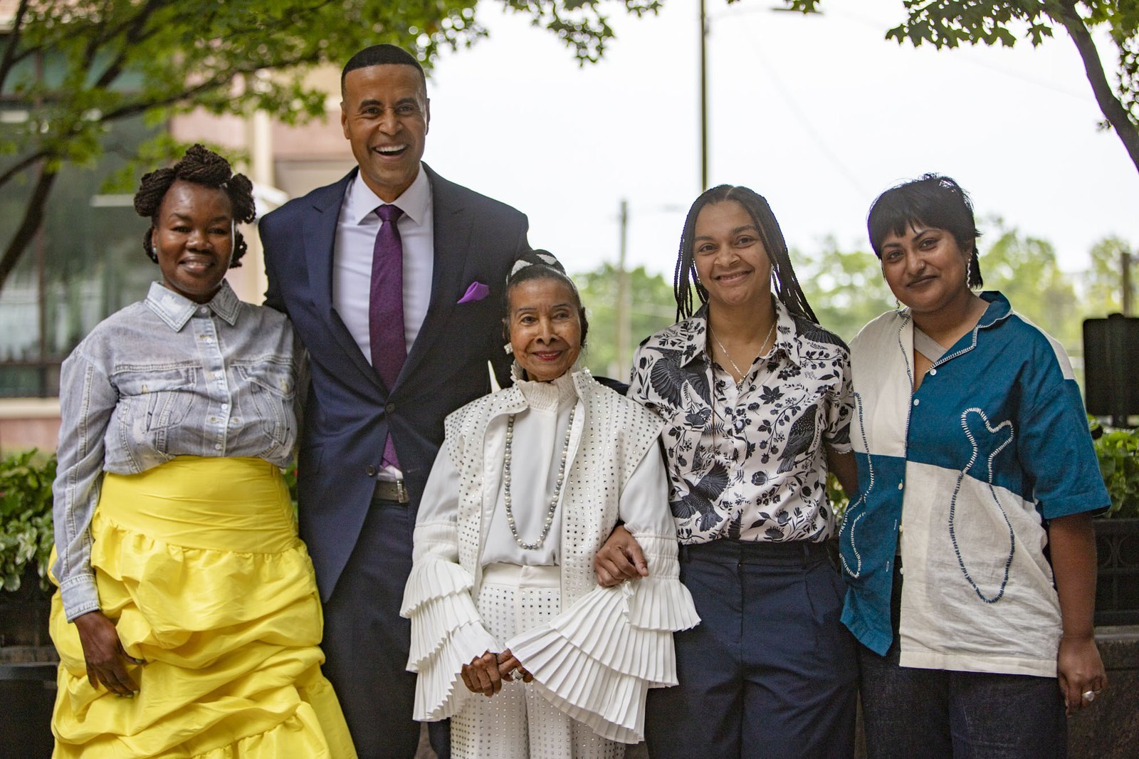 Xernona Clayton, center in white, with artists Grace Kisa, Chloe Alexander and Sayma Hossain and emcee Fred Blankenship at her 95th birthday celebration at Hardy Ivy Park in downtown Atlanta