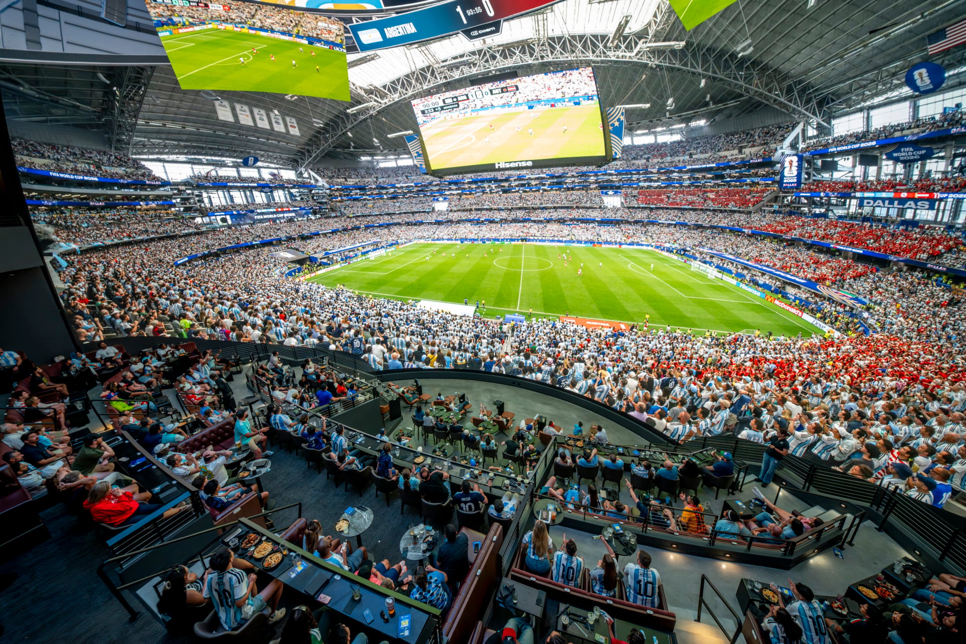 Fans inside Cosm Atlanta's immersive Dome watching a FIFA World Cup 2026 match