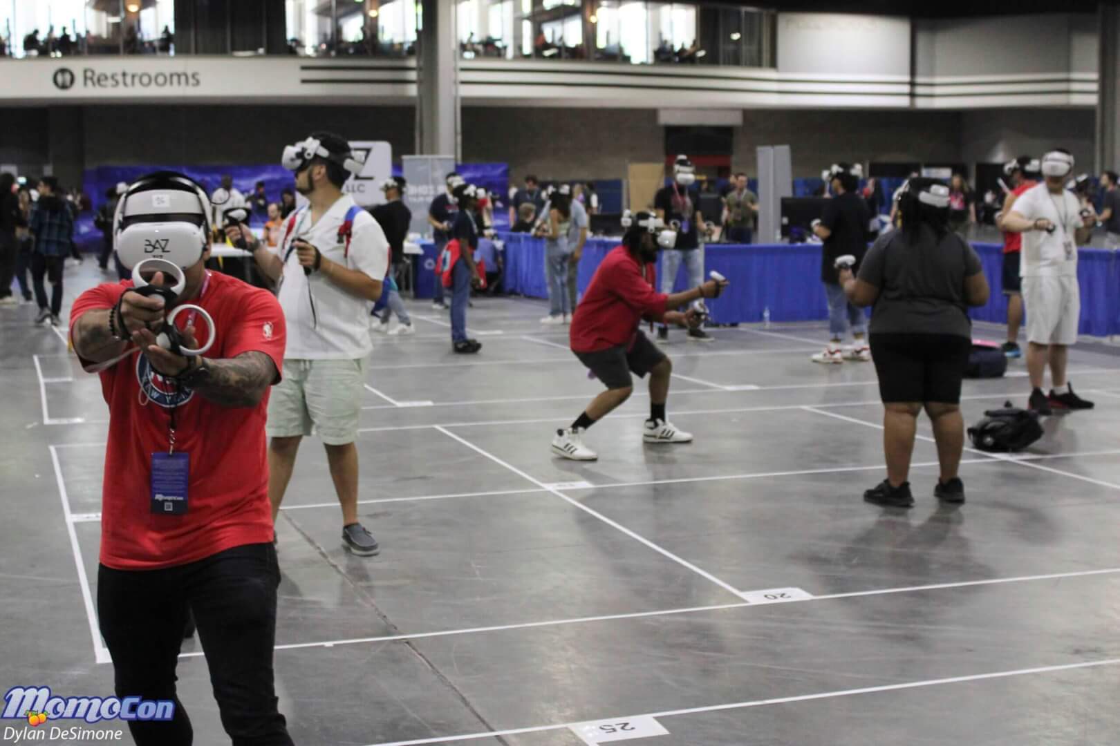 Cosplayers and attendees on the MomoCon show floor at the Georgia World Congress Center.