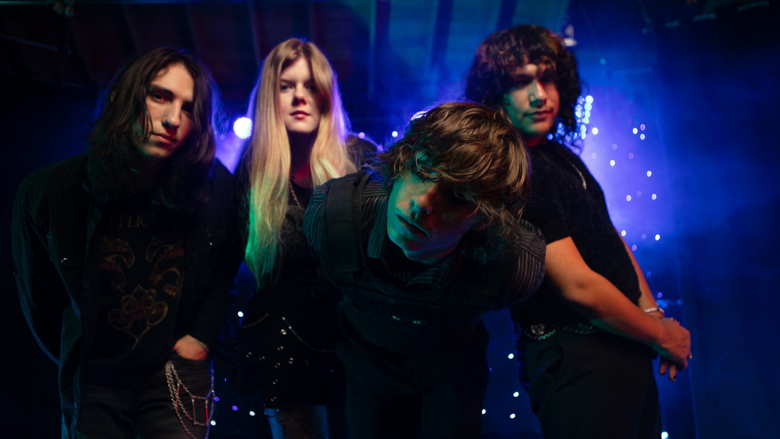 My Upside Down band photo, four members under blue stage light