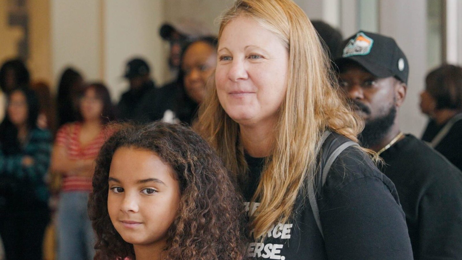 Visitors of different ages gather in a gallery at the National Center for Civil and Human Rights during a program