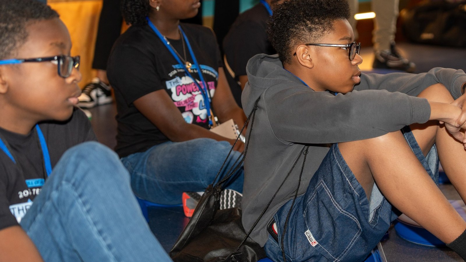 Children seated on floor cushions listen during a Saturday Adventures program at the National Center for Civil and Human Rights